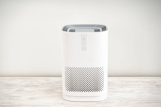 istock Air purifier with ionization in the room on a light background. 1355163687