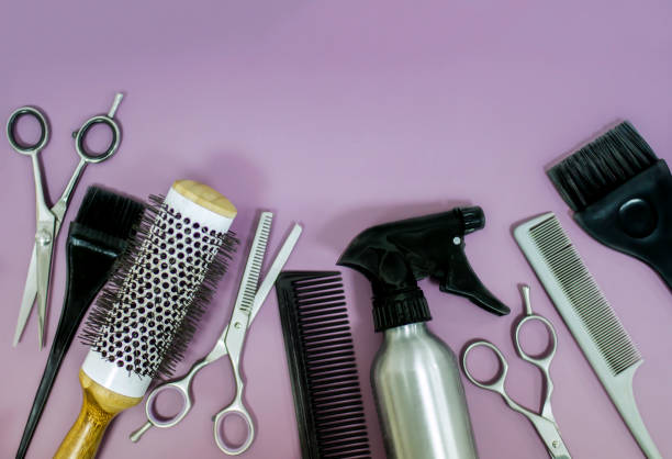 istock Professional hair dresser tools on purple background with copy space 1355165387