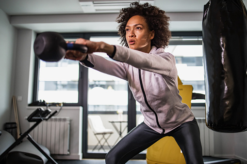 Photo of a woman in the gym, doing exercises