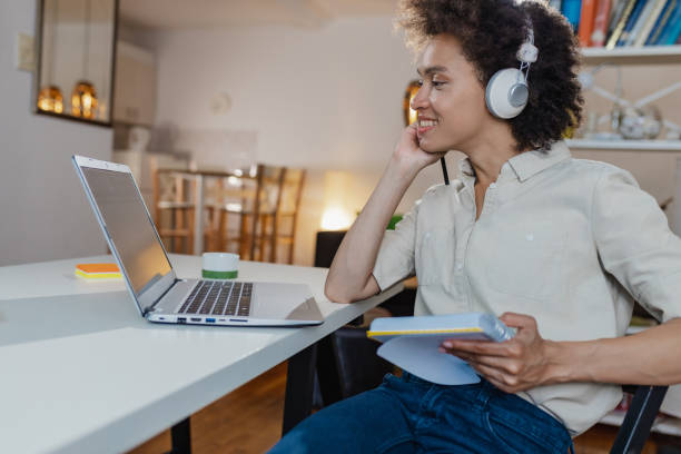 istock Woman works at home on laptop 1355167054