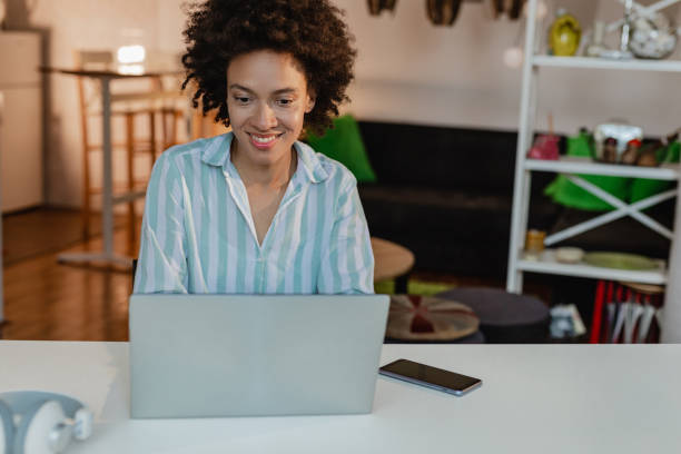istock Woman working on laptop at home 1355167364