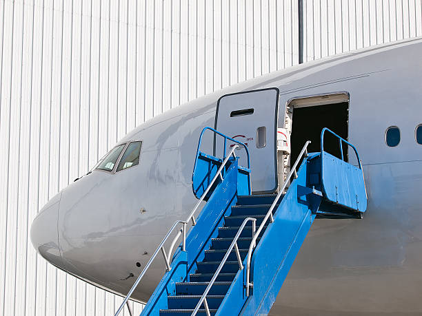 istock Big passenger airplane parked near hangar 135516965