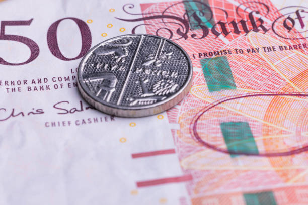 istock Fifty pounds and five pence 1355169859