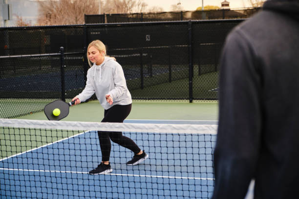 istock Young Adults Playing Pickleball 1355169947