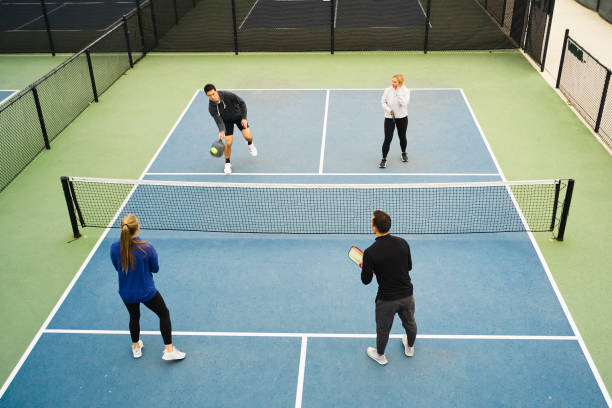 istock Young Adults Playing Pickleball 1355170038