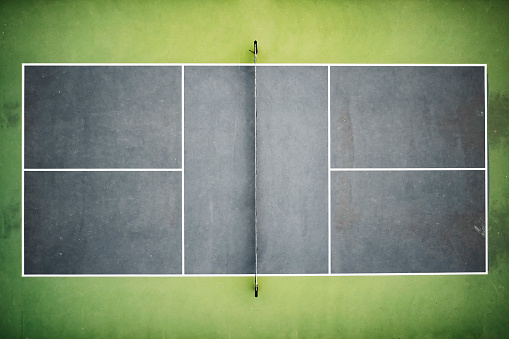 A Pickleball court scene from an overhead vantage point.
