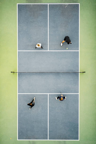istock Young Adults Playing Pickleball 1355170075