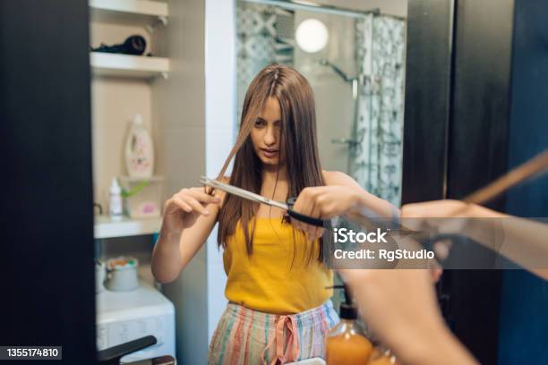 Girl Doing Herself Hairstyle At Home Stock Photo - Download Image Now - Cutting, Hair, 20-24 Years