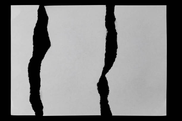 istock white paper sheets with ragged edges isolated on a black background 1355175959