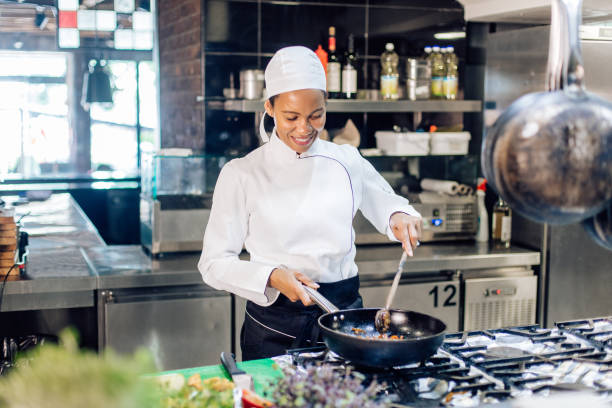 istock Female chef cooking fine dishes at the restaurant 1355175989