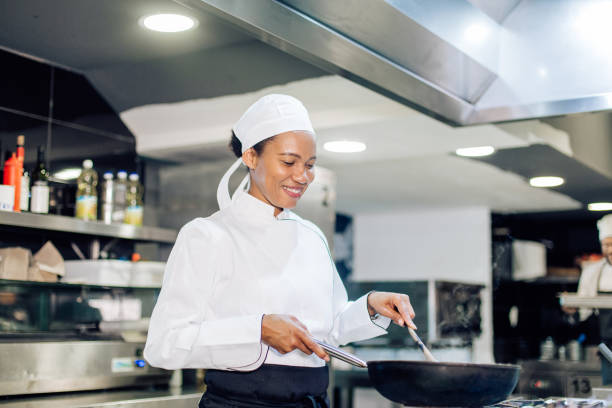 istock Female chef cooking fine dishes at the restaurant 1355175994