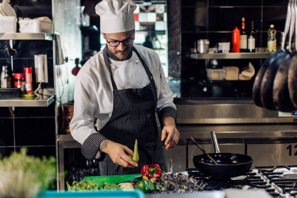 istock Chef preparing a vegetable dish at the restaurant kitchen 1355175998