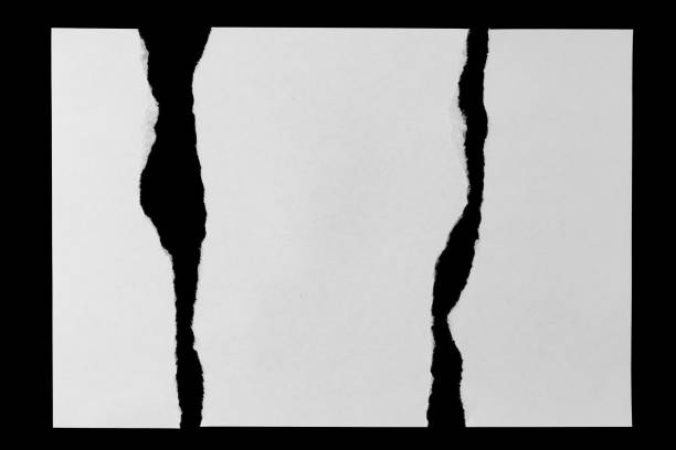 istock white paper sheets with ragged edges isolated on a black background 1355176075