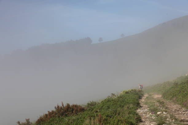 istock Hills and roads in fog 1355184743