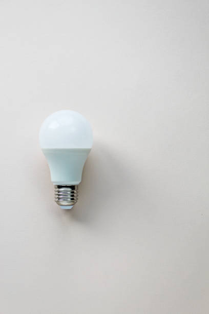 istock Energy-saving and eco-friendly life. Creative top view flat lay of LED light bulbs composition with copy space in minimal style. 1355184804