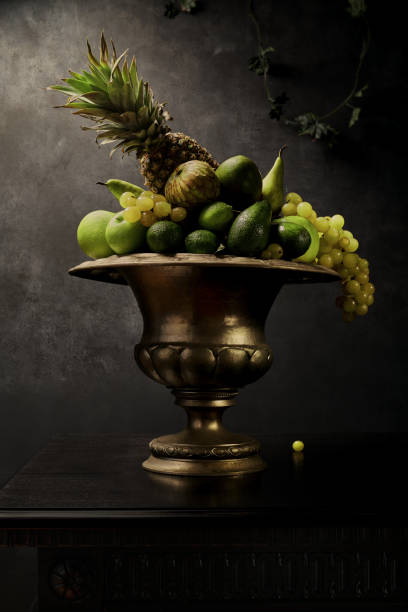 istock Still Life with Green Fruits in silver vase. 1355186480