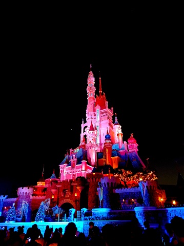 Disneyland Resort Hong Kong, November 2021 : Beautiful night view of iconic buildings with decorative lights at Disneyland Resort Hong Kong
