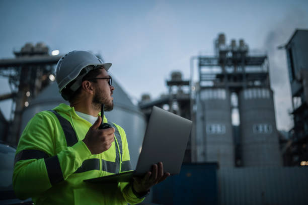 istock Engineer working on laptop while gas and oil industry. 1355188669