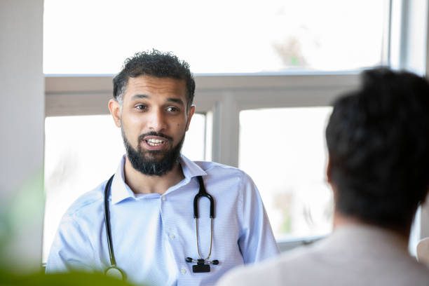 istock Medical Professional and Patient greeting each other 1355188796