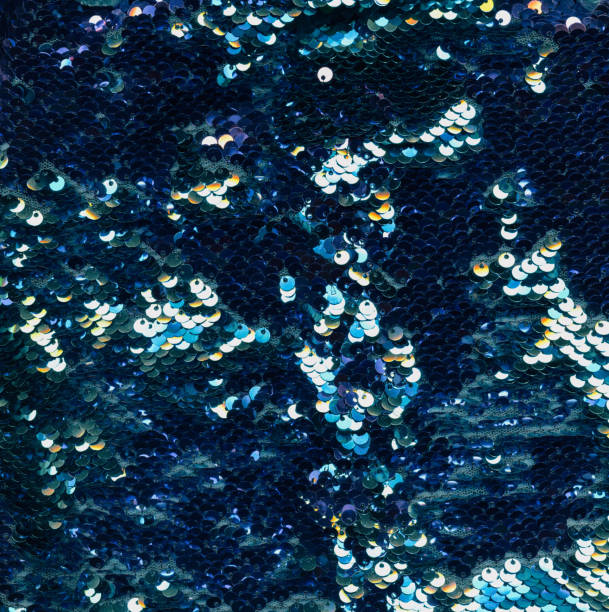 shiny background scale texture blue silver sequin Shiny background. Scale texture. Glamour fabric embroidery. Blue silver iridescent metallic glitter circle sequin decoration on mesh cloth abstract backdrop. sequence dress stock pictures, royalty-free photos & images