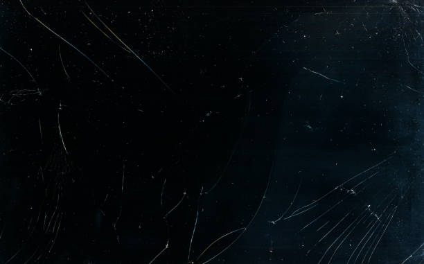 broken glass texture dust scratches overlay dark Broken glass texture. Dust scratches overlay. Fractured laptop screen. Grunge dark black blue damaged dirty weathered mask with grain stains. scratched stock pictures, royalty-free photos & images
