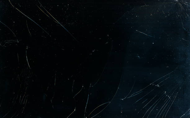broken glass texture dust scratches overlay dark Broken glass texture. Dust scratches overlay. Fractured laptop screen. Grunge dark black blue damaged dirty weathered mask with grain stains. black glass surface stock pictures, royalty-free photos & images