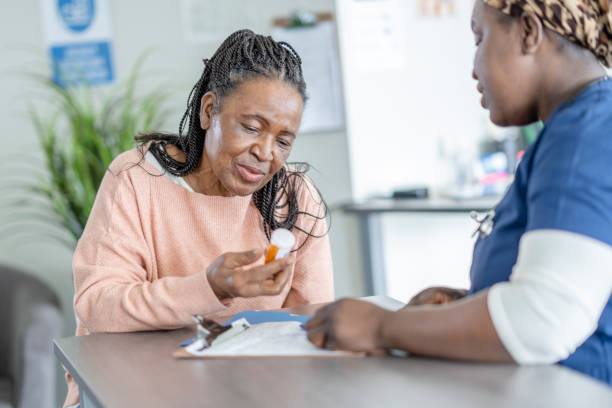 istock Senior Woman Discussing Her Medications 1355189509