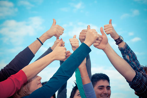 istock College students with their thumbs up 135519012