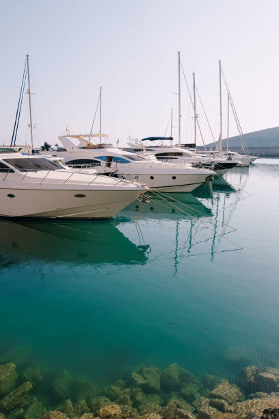 Row of moored yachts. Lustica Bay Row of moored yachts. Lustica Bay. High quality photo moored photos stock pictures, royalty-free photos & images