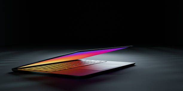 istock 3D rendering illustration. Laptop computer with colorful screen and keyboard close lid place in the darkroom and lighting effect. Image for presentation. 1355196353