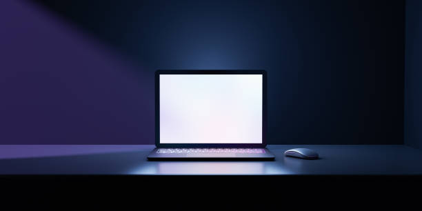 istock 3D rendering illustration. Laptop computer with blank screen and color keyboard place table in the darkroom and blue lighting. Image for presentation. 1355196354