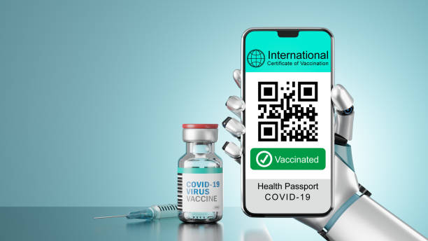 istock 3D illustration rendering of Smartphone mobile with vaccinated screen hold by robot hand and vaccine bottle in light blue screen. 1355196364