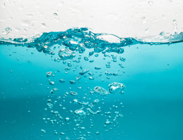 istock Water waves splash with air bubbles, isolated on the white background. abstract blue water waves on a white background. for a product, advertising,text space 1355199238