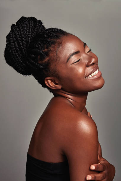 istock Studio shot of an attractive young woman posing against a grey background 1355200074