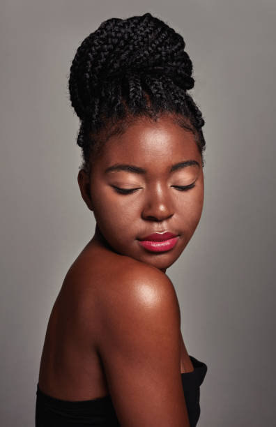 istock Studio shot of an attractive young woman posing against a grey background 1355200091