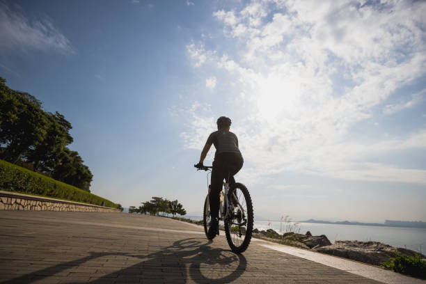 istock Riding bike on the coast path 1355201314