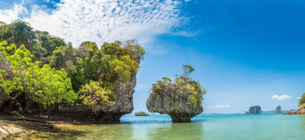 Island Phuket Thailand. Lovely rock in the middle of the ocean surrounded by mountains