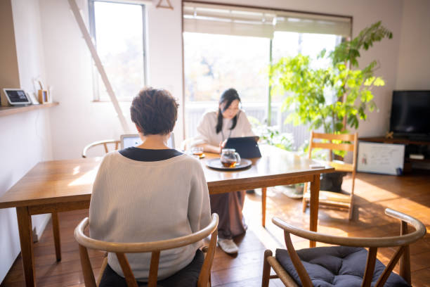 Japanese women working at home office stock photo