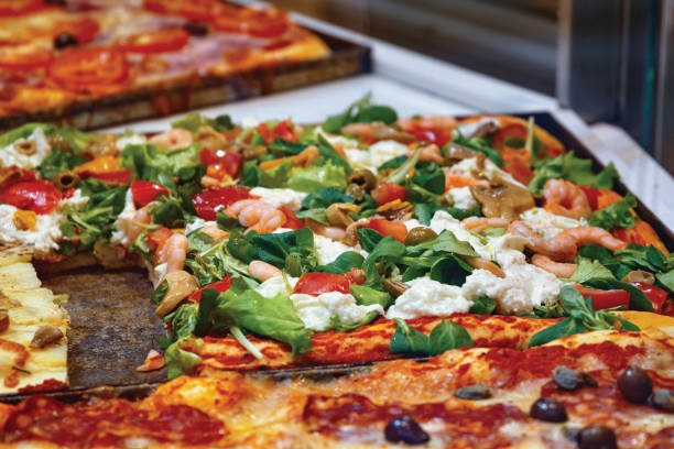 istock Pieces of Italian pizza with seafood. 1355210501
