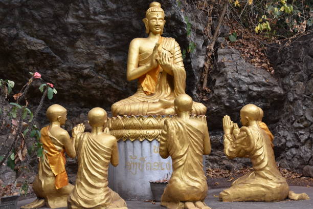 istock Seated Golden Buddha in Vitarka Mudra 1355214838