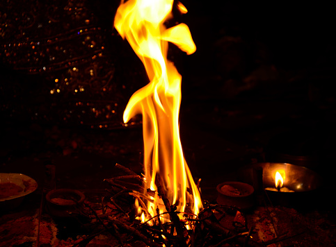 A beautiful view of the flames of the campfire in the darkness for havan pooja