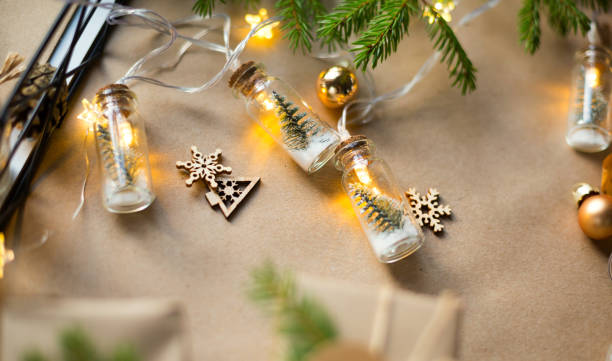istock Background with copyspace for Christmas and new year in eco-friendly materials: kraft paper, gift box, live fir branches, cones, twine. Tags with mock up, natural decor, hand made, DIY. Flatly 1355221703
