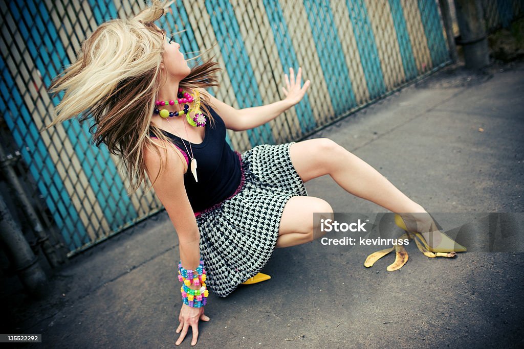 Model Falling on a Banana Peel woman slipping on a banana peel Banana Peel Stock Photo