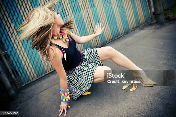 Model Falling On A Banana Peel Stock Photo - Download Image Now - Banana Peel, Women, Falling