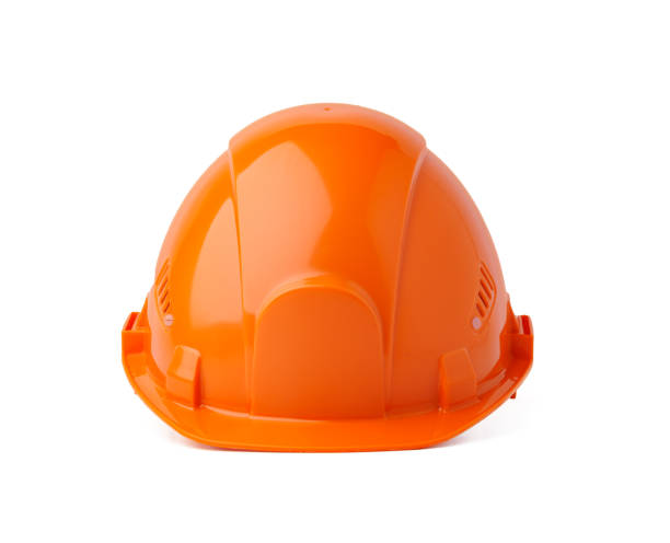 istock Orange plastic safety helmet isolated on white background 1355224684