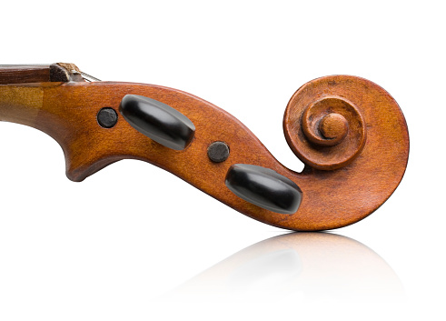 Antique violin scroll isolated on white background.