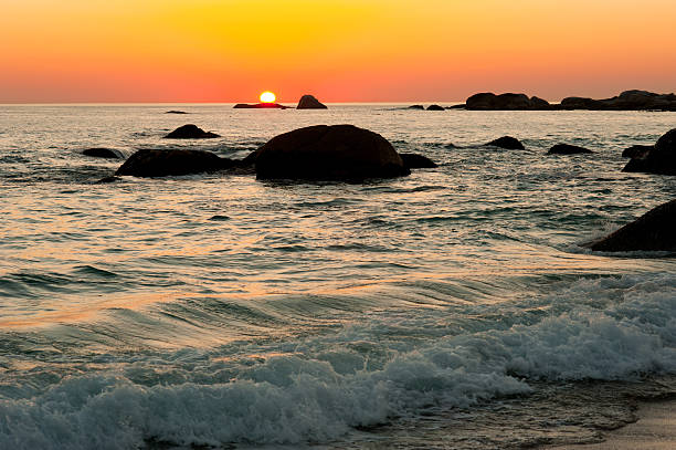 istock calm ocean at sunset with breaking waves, south africa 135522610