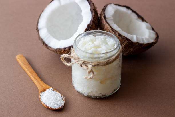 istock Coconut oil in a jar and fresh coconuts. Natural cosmetics. 1355227146