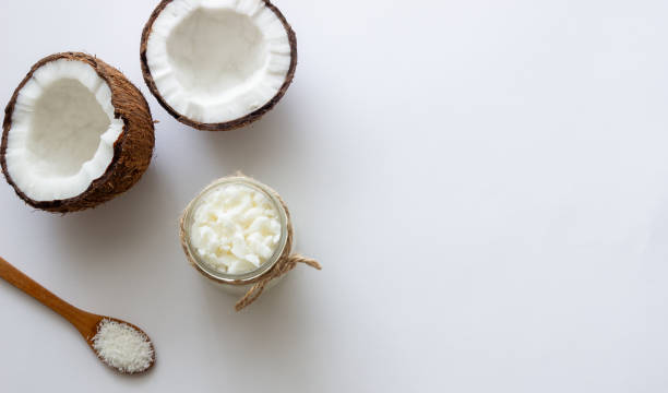 istock Coconut oil in a jar and fresh coconuts. Natural cosmetics. 1355227175