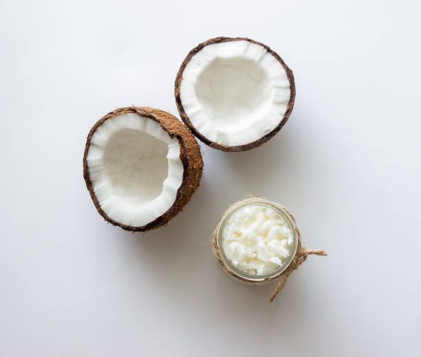 istock Coconut oil in a jar and fresh coconuts. Natural cosmetics. 1355227228